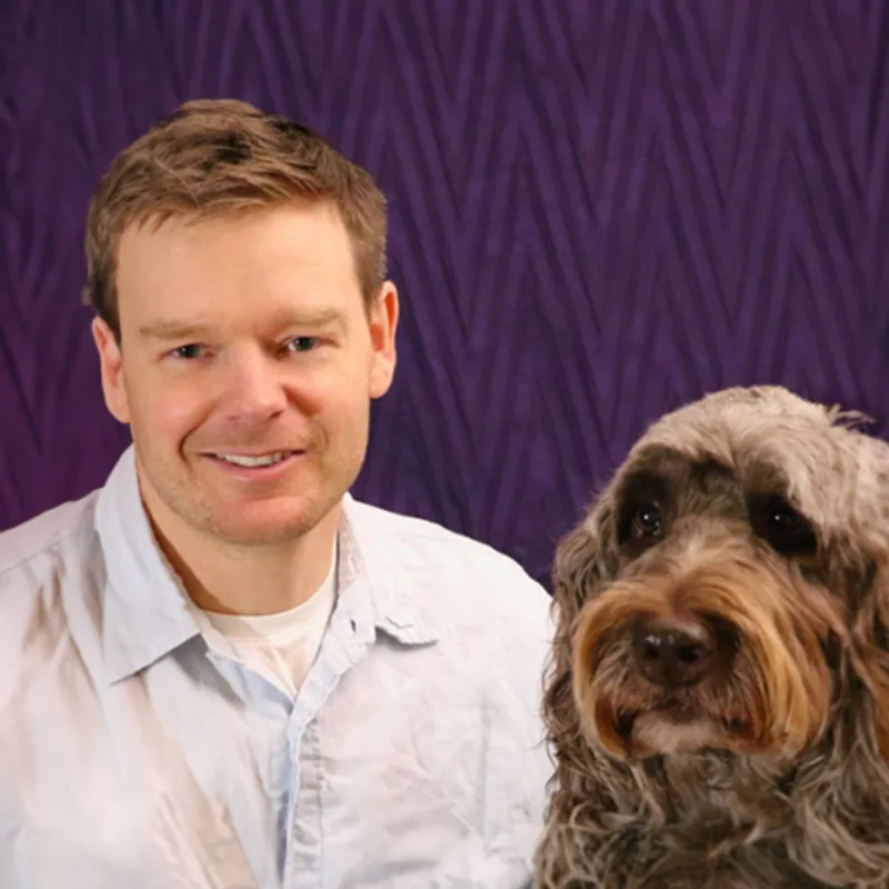 Dr. Dan Cartwright and a brown dog Dr. Dan Cartwright and a brown dog