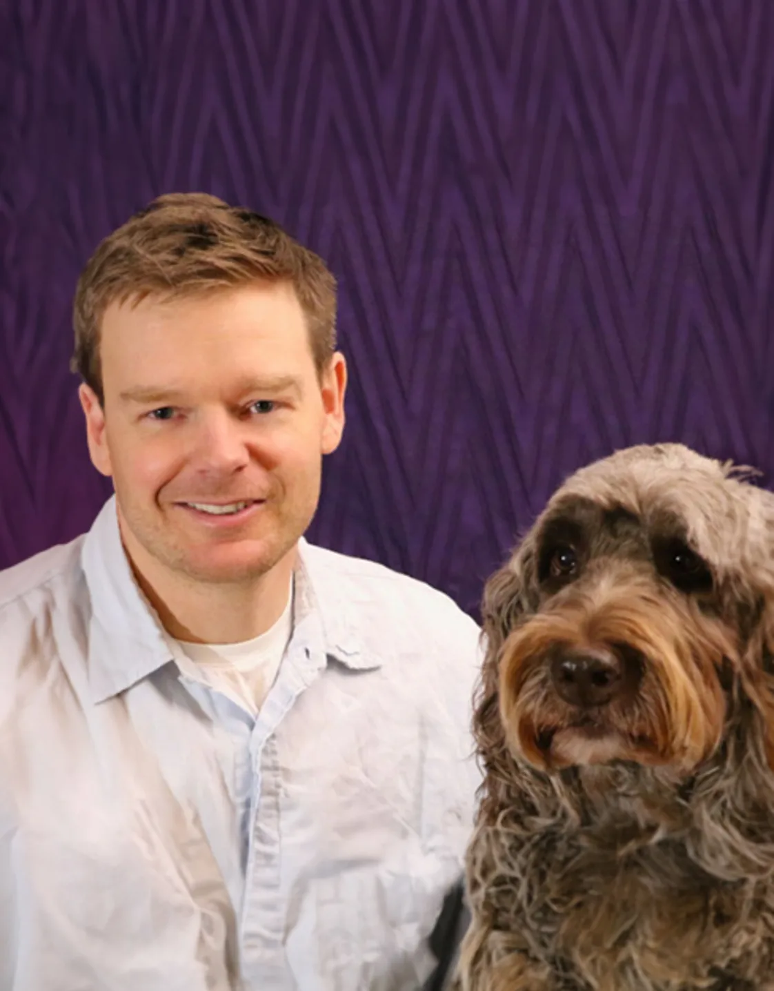 Dr. Dan Cartwright and a brown dog Dr. Dan Cartwright and a brown dog