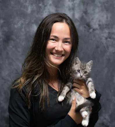 Colby holding a small gray and white kitten Colby holding a small gray and white kitten