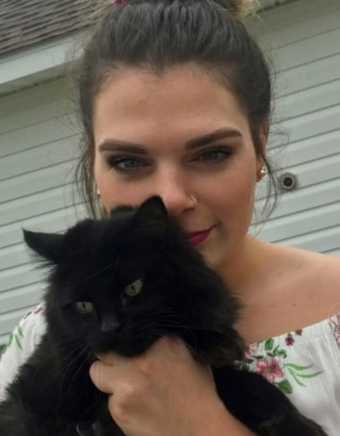 Maegan Middleton holding a black cat Maegan Middleton holding a black cat