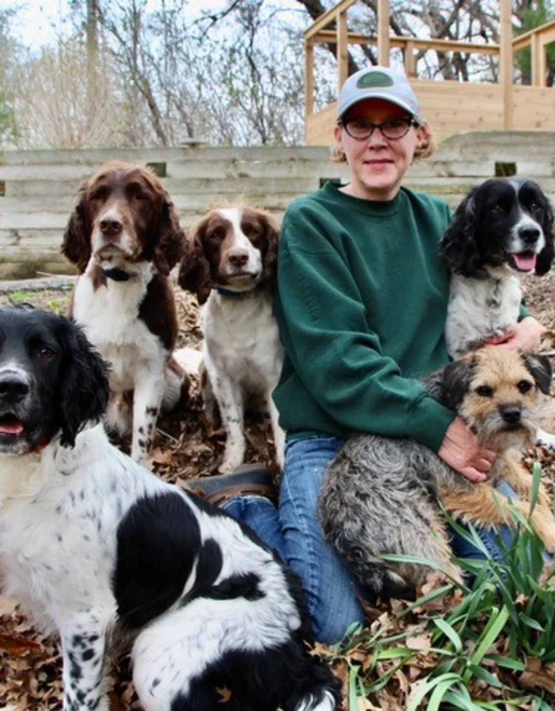 Nancy's staff photo from Stillwater Veterinary Clinic's and two dogs are besides her posing for a picture Nancy's staff photo from Stillwater Veterinary Clinic's and two dogs are besides her posing for a picture