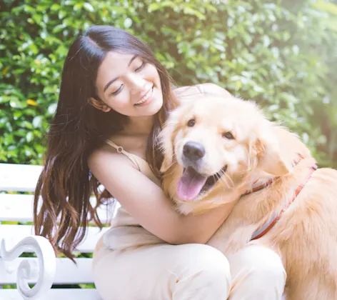 Woman with Dog on Bench