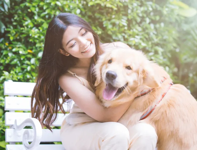 Woman with Dog on Bench