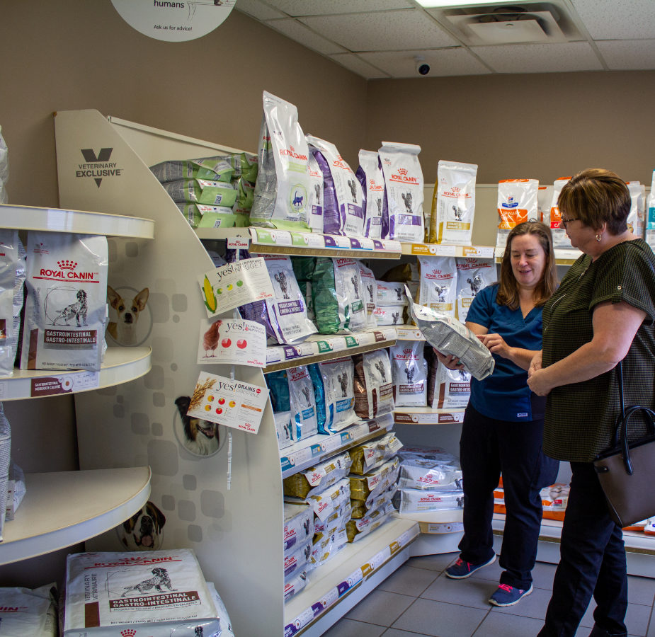 Staff member helping a customer in our hospital store