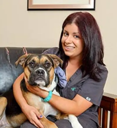 Vet Tech Amanda hugging dog Vet Tech Amanda hugging dog