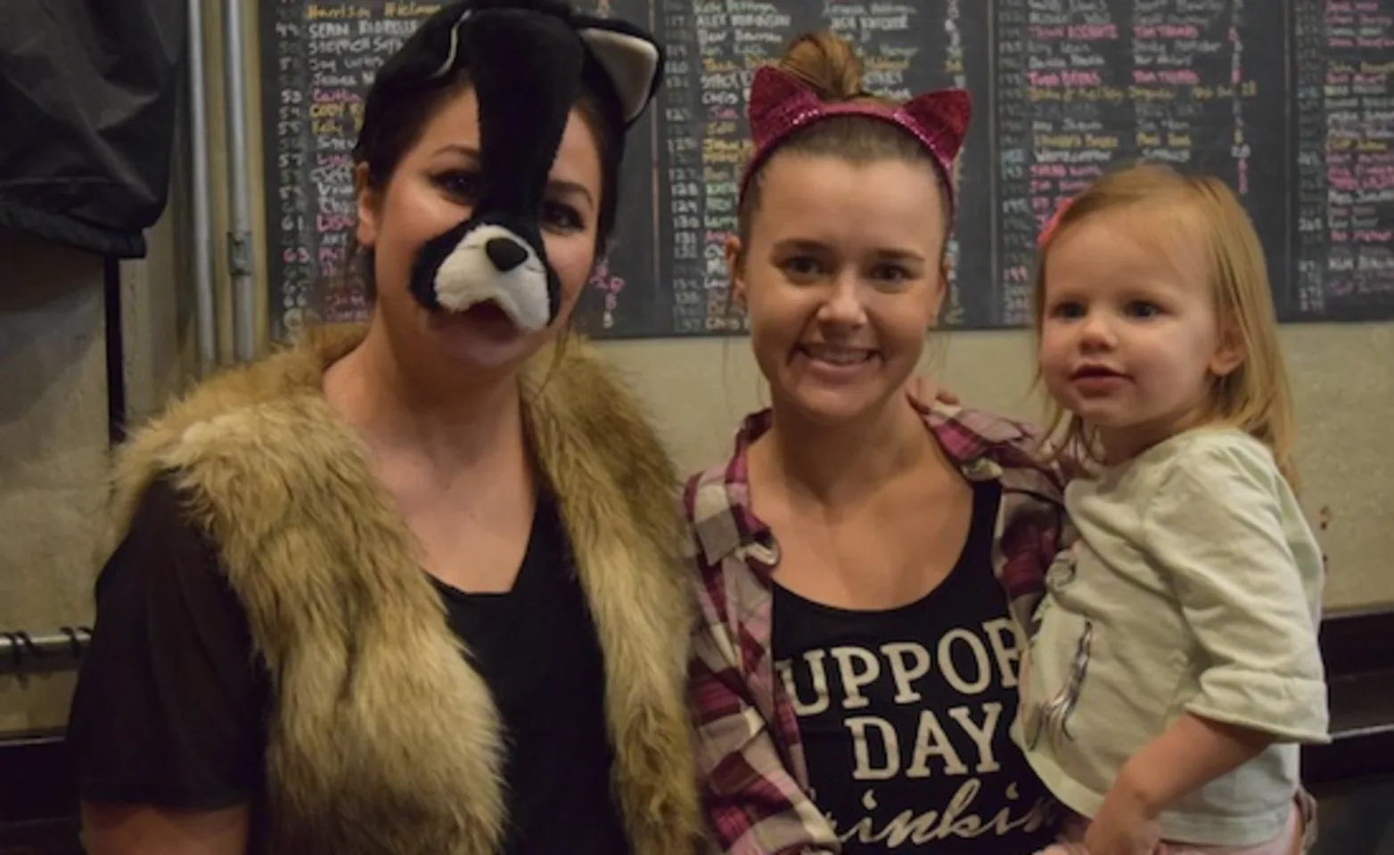 People wearing animal themed costumes People wearing animal themed costumes