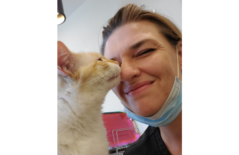 Woman Next to Cat with their Faces Close