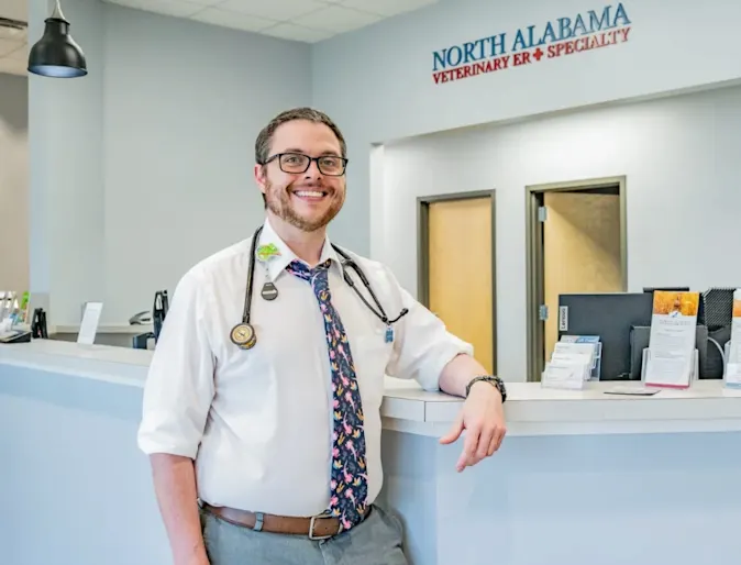 Dr. Wood leaning against NAVES' reception desk. Dr. Wood leaning against NAVES' reception desk.