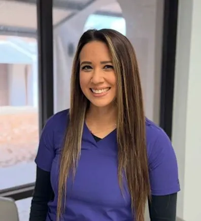 Katie Martinez sitting down with a brown dog Katie Martinez sitting down with a brown dog