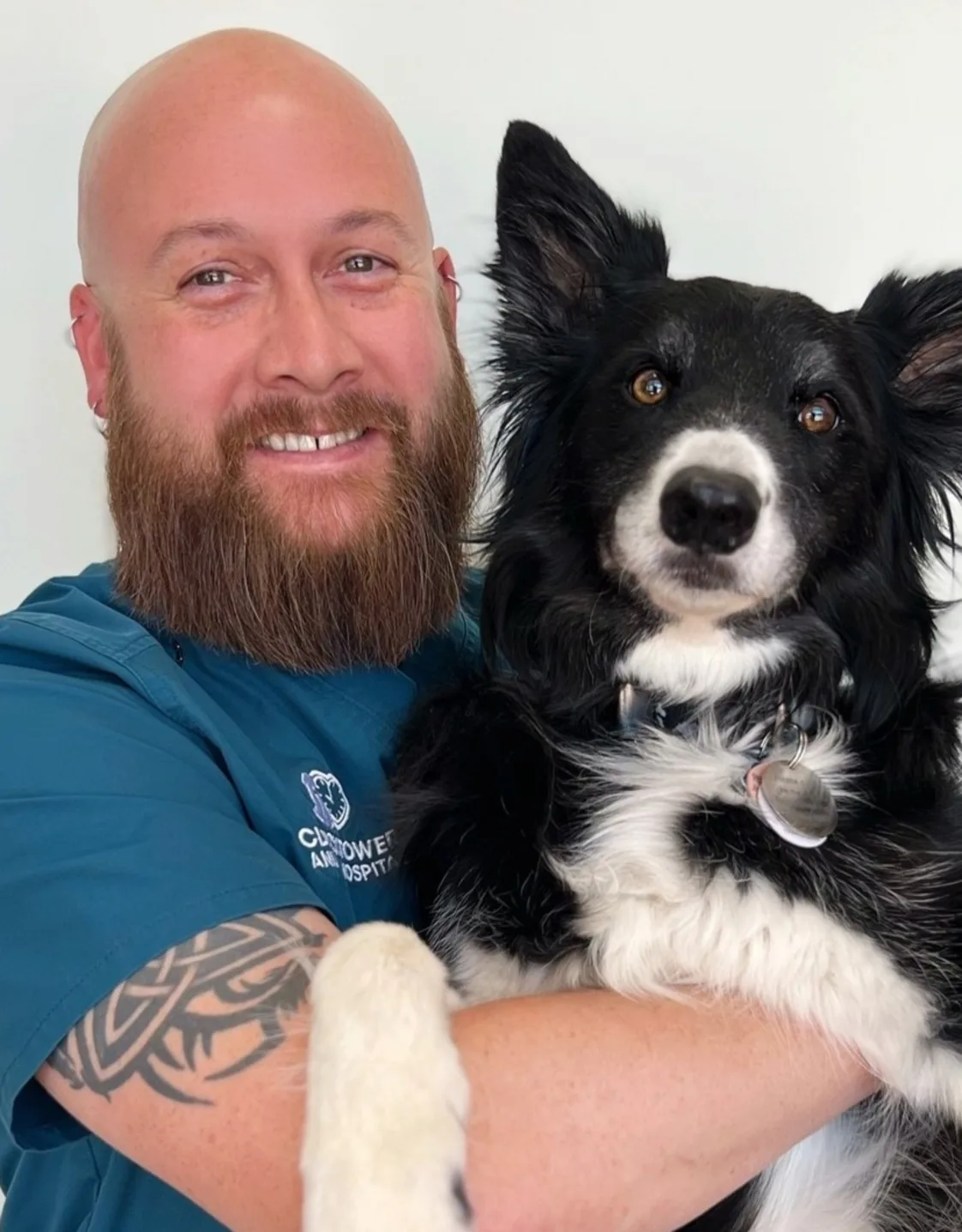 Joe at Clocktower Animal Hospital, with black and white dog Joe at Clocktower Animal Hospital, with black and white dog