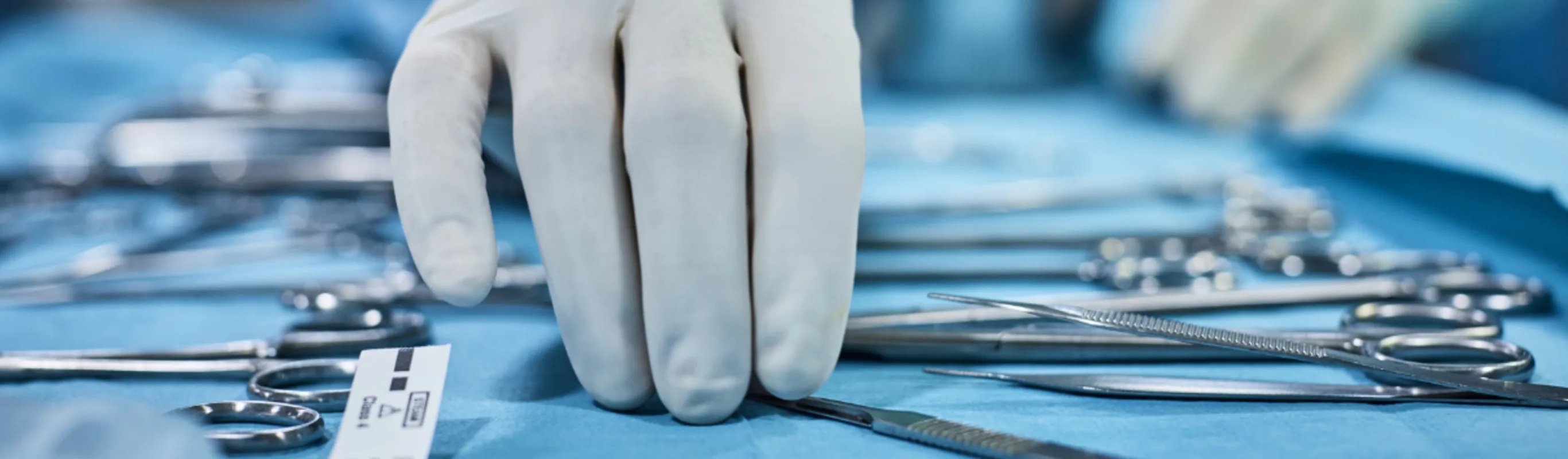 A neurosurgeon picking out tools A neurosurgeon picking out tools