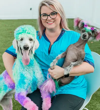 Danielle Wilson Grantham with two colorful dogs Danielle Wilson Grantham with two colorful dogs