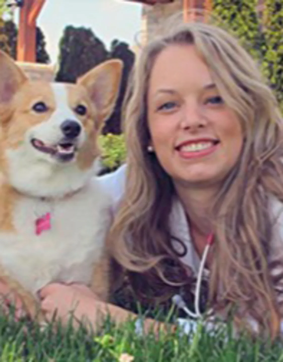 A photo of Dr .Stepanie with a corgi. A photo of Dr .Stepanie with a corgi.