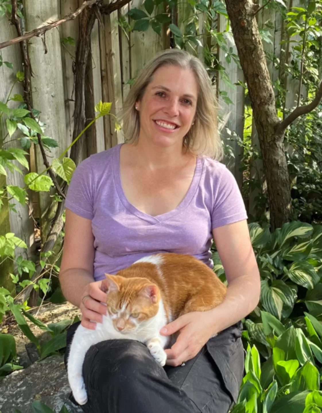 Dr. Emily Simpson Holding a White/Orange Cat Dr. Emily Simpson Holding a White/Orange Cat