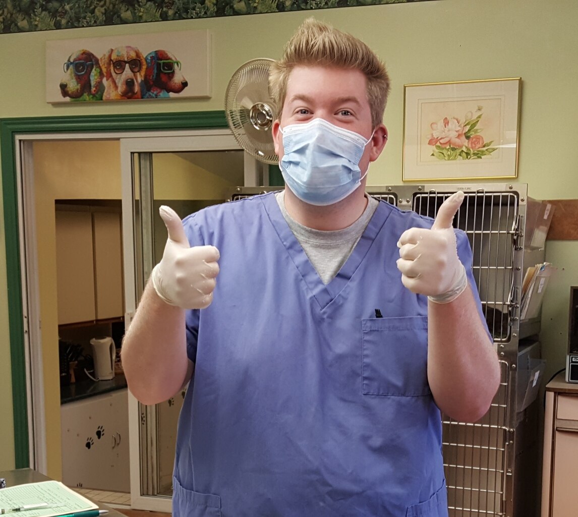 Vet assistant Mitch doing a thumbs up at Three Islands Veterinary Services