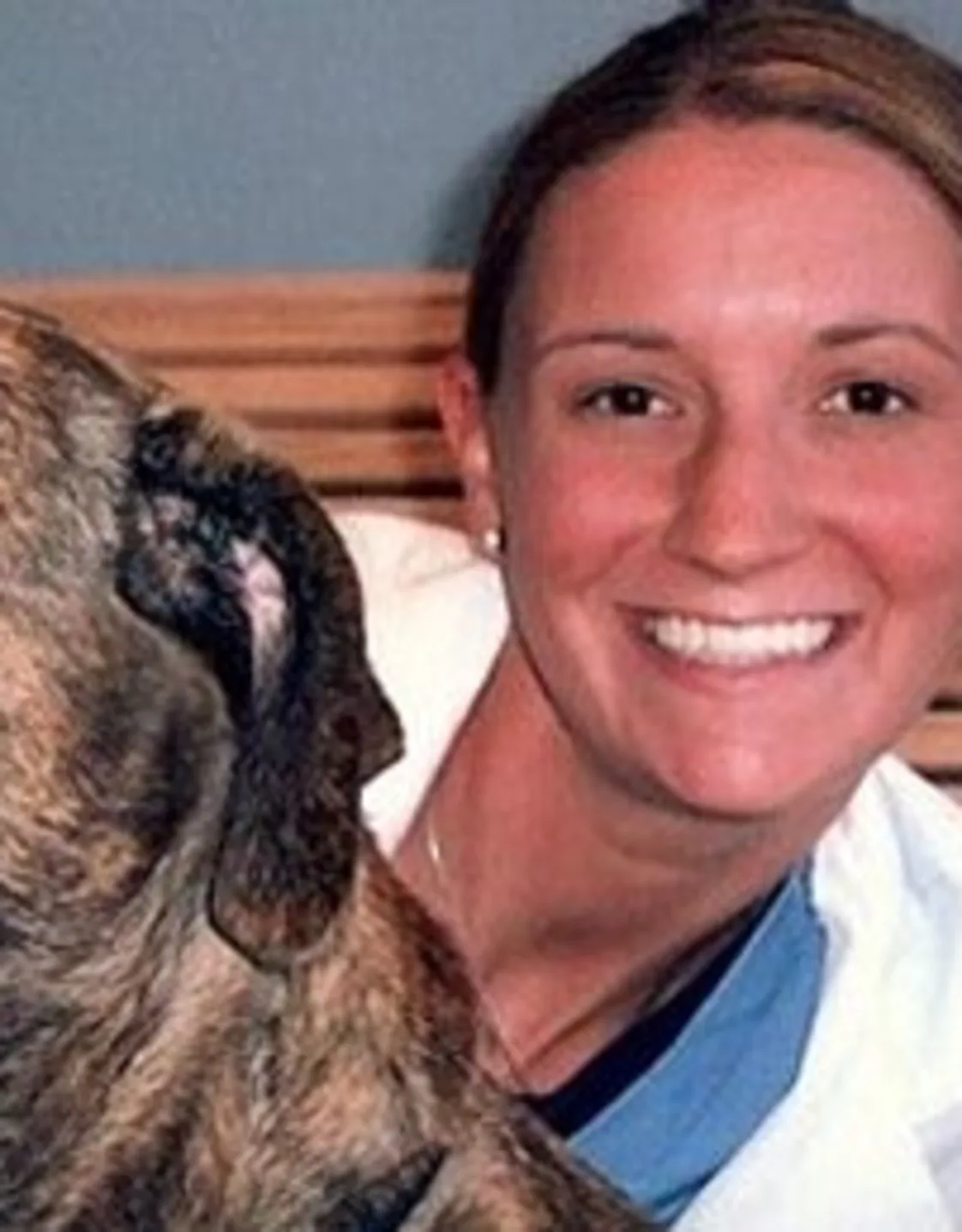 Dr. Miller with a dog. Dr. Miller with a dog.