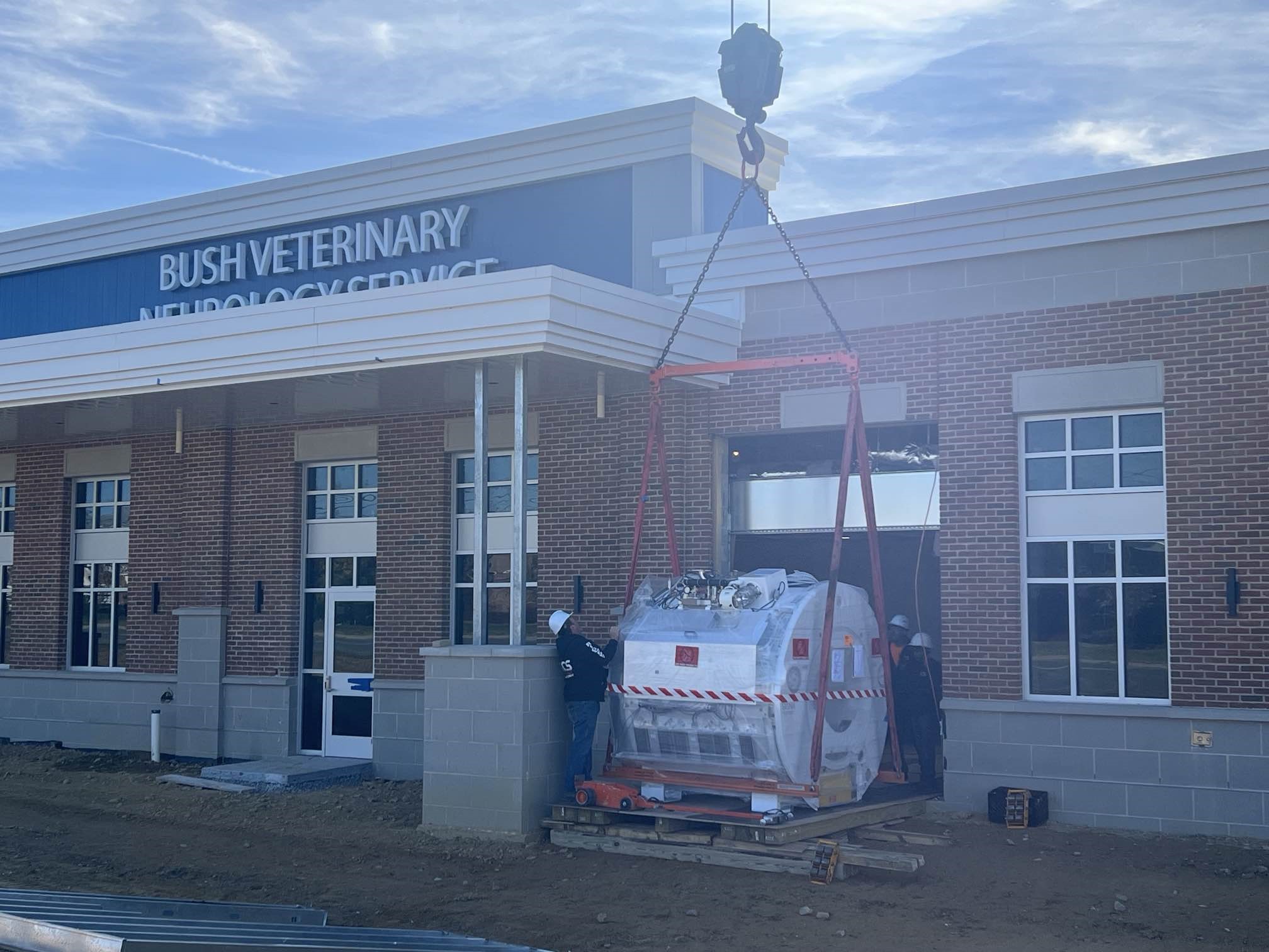 MRI machine being craned into hospital