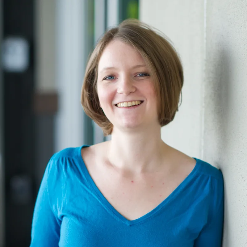Sarah Trab in a blue blouse. Sarah Trab in a blue blouse.