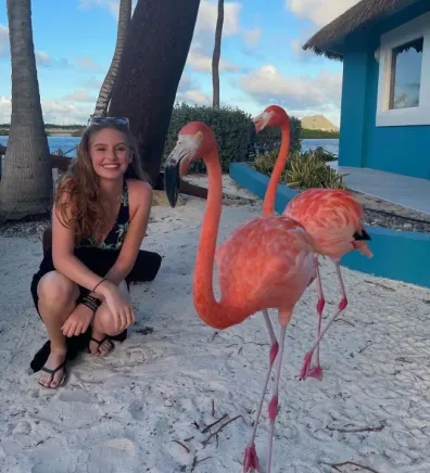 Hailey with two flamingos