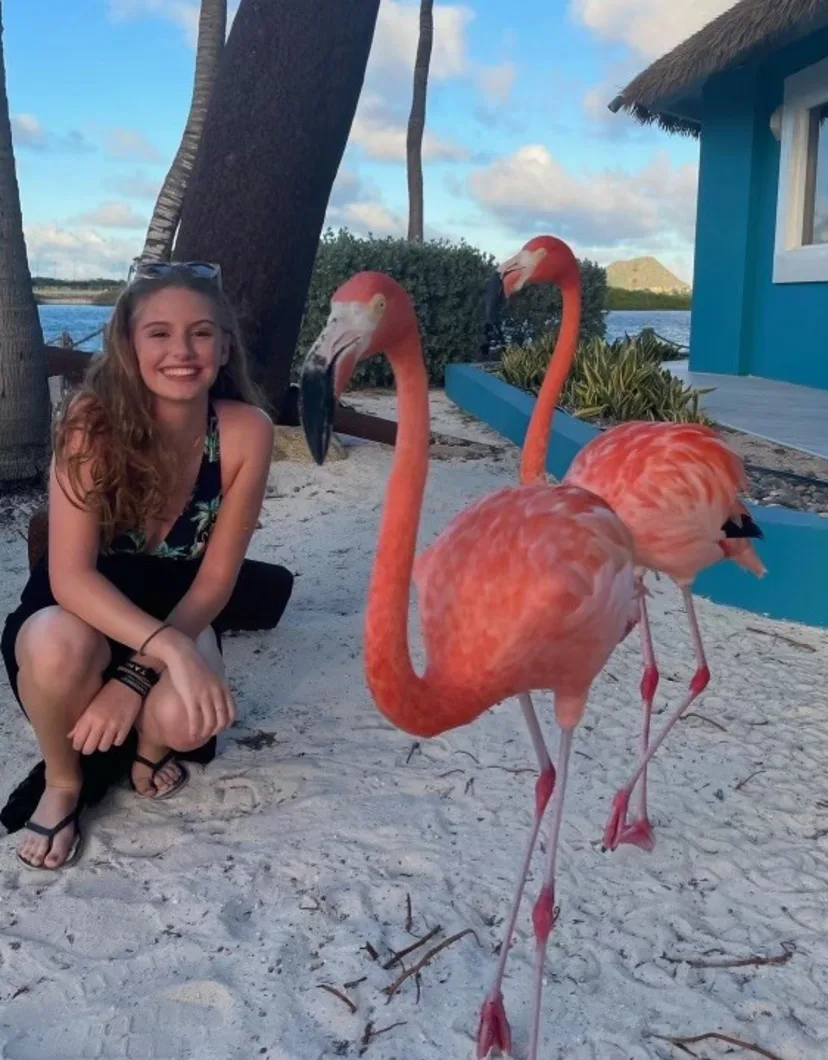 Hailey with two flamingos