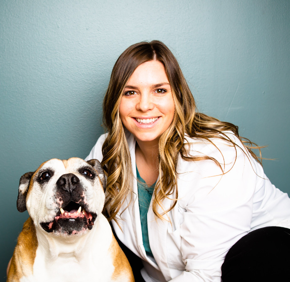 A Kindness Animal Hospital staff member with a dog
