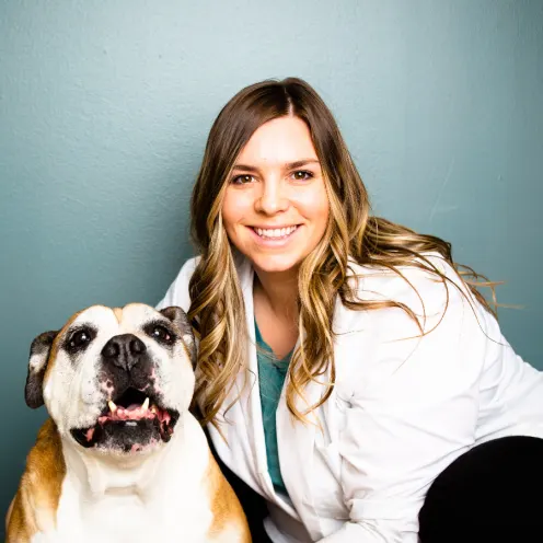 A Kindness Animal Hospital staff member with a dog