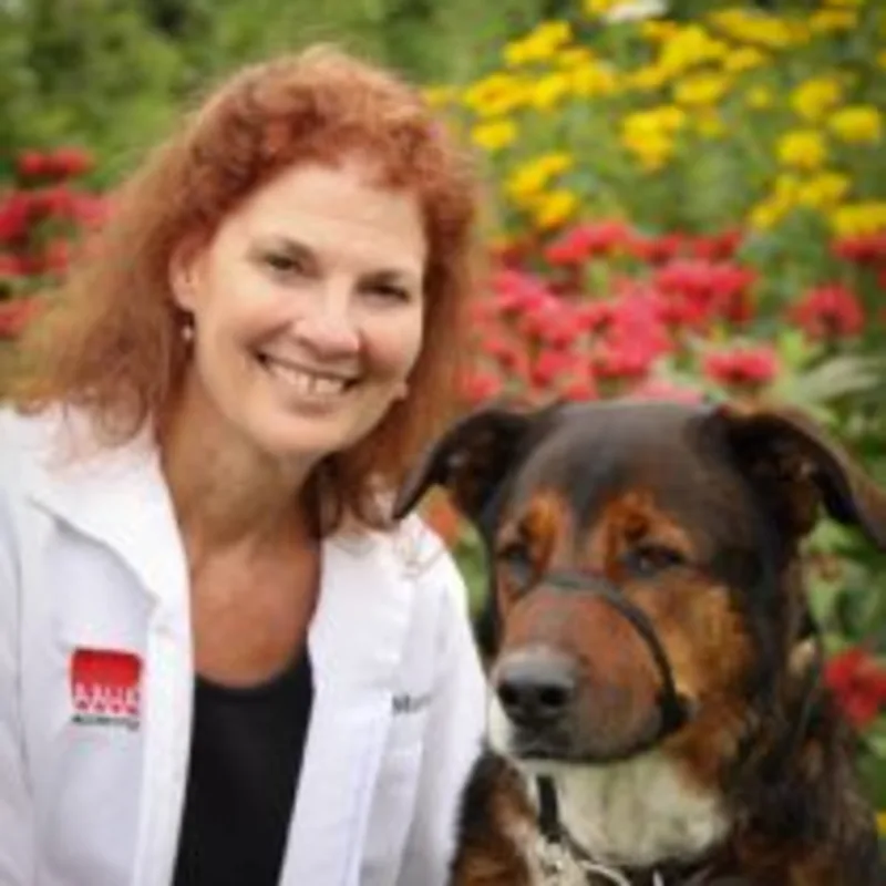 Linda I. Morris sitting next to dog Linda I. Morris sitting next to dog