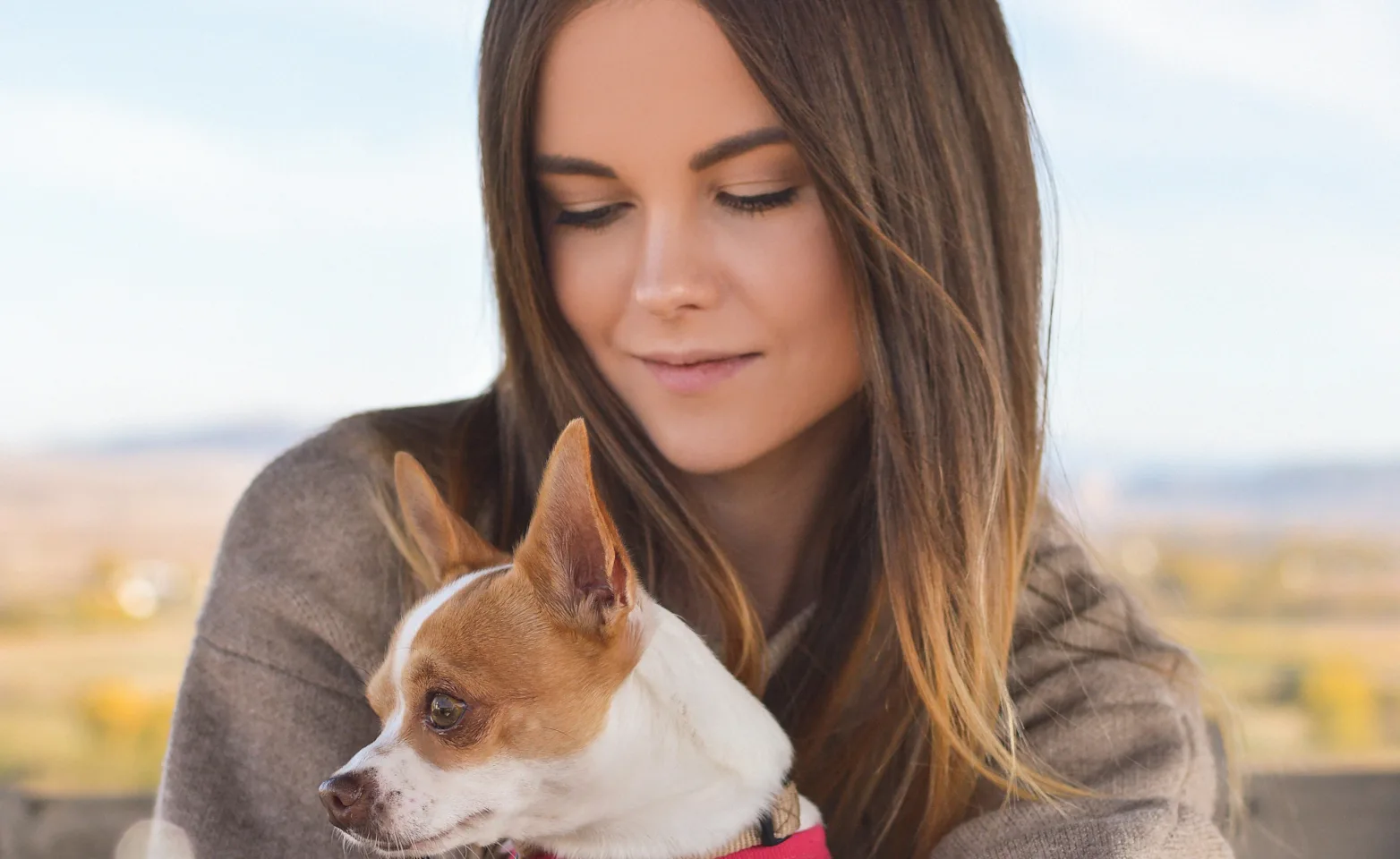 Woman sitting with her dog Woman sitting with her dog