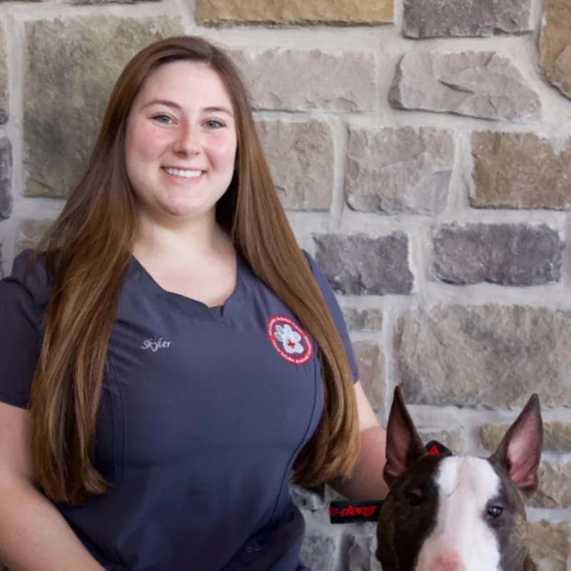 Skyler Brown with a dog named Weston Skyler Brown with a dog named Weston
