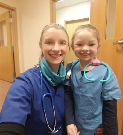 Amanda Reed with a child. Amanda Reed with a child.