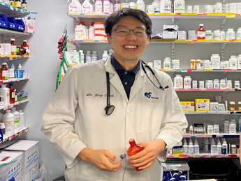 DVM in front of pharmacy area at Pender Veterinary Centre