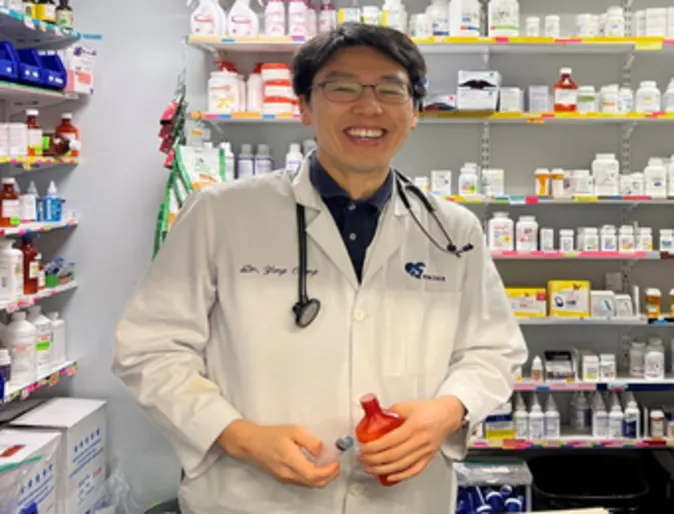 DVM in front of pharmacy area at Pender Veterinary Centre DVM in front of pharmacy area at Pender Veterinary Centre