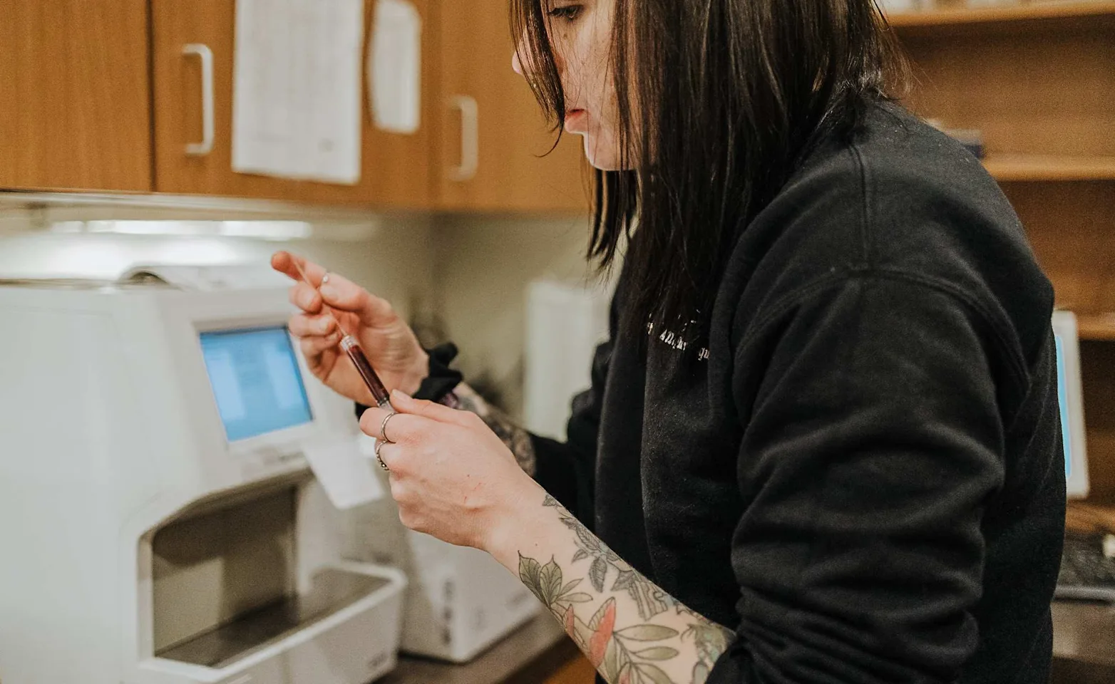 Staff Analyzing a Vial Staff Analyzing a Vial