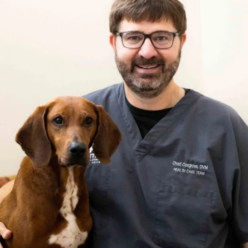 Dr. Chad Cosgrove with dog. Dr. Chad Cosgrove with dog.