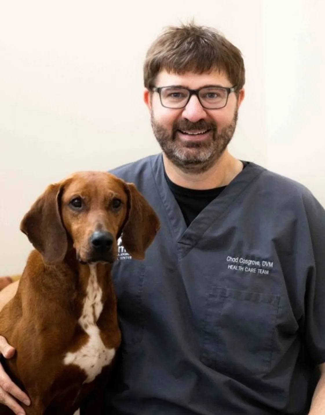 Dr. Chad Cosgrove with dog. Dr. Chad Cosgrove with dog.