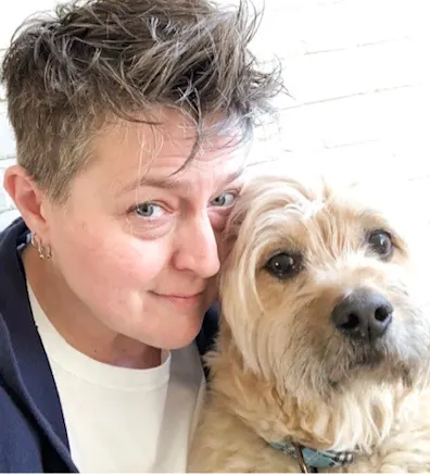 Jennifer Lewis, Hospital Manager at South Paw Animal Care, with light tan dog Jennifer Lewis, Hospital Manager at South Paw Animal Care, with light tan dog