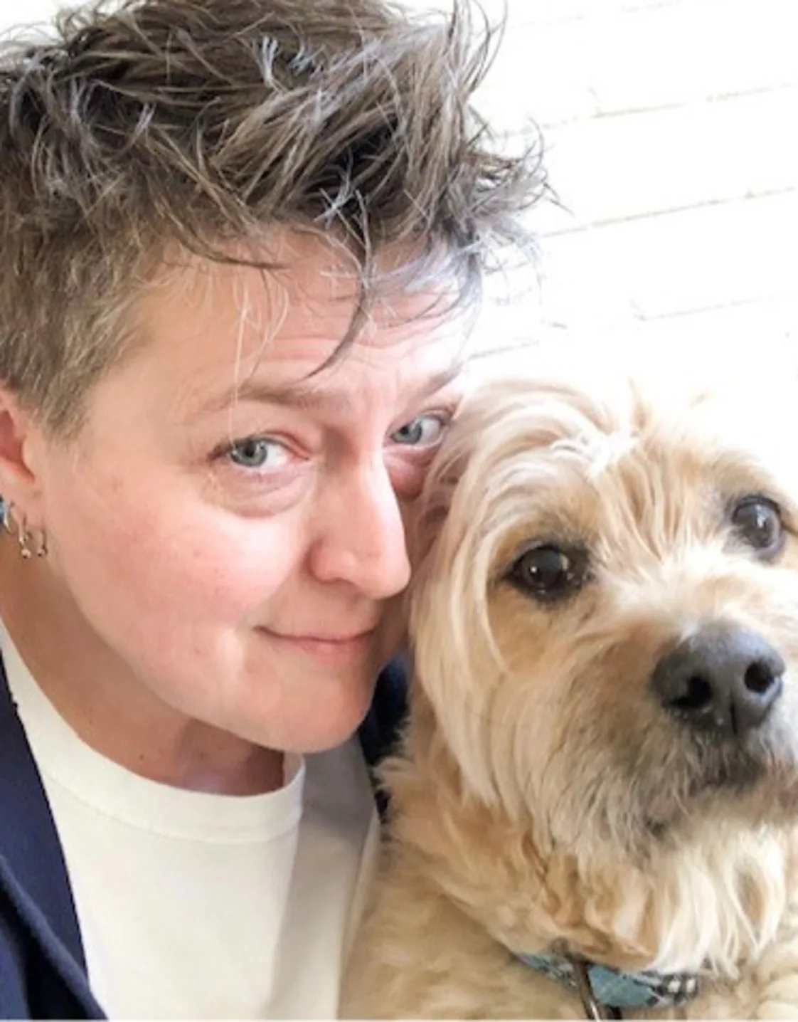 Jennifer Lewis, Hospital Manager at South Paw Animal Care, with light tan dog Jennifer Lewis, Hospital Manager at South Paw Animal Care, with light tan dog