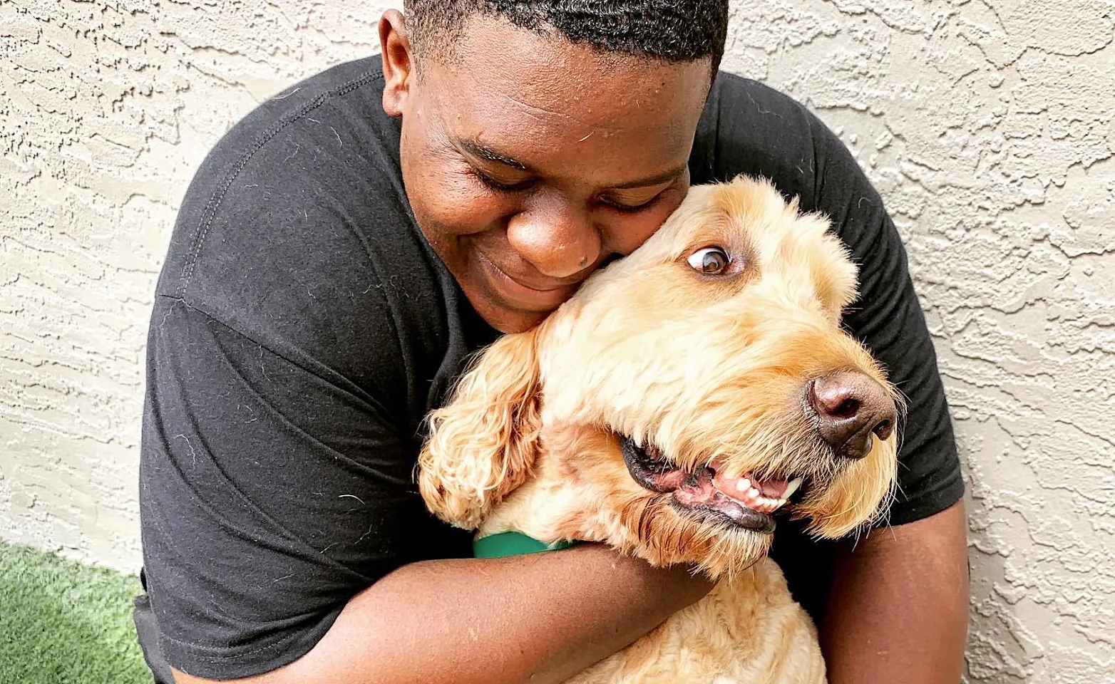 PPH staff hugging a dog