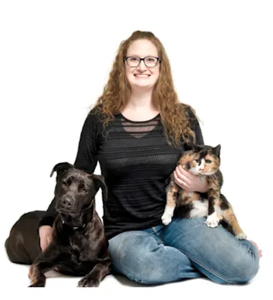 A portrait photo of Client Care Specialist Jolyne with her dog and cat A portrait photo of Client Care Specialist Jolyne with her dog and cat