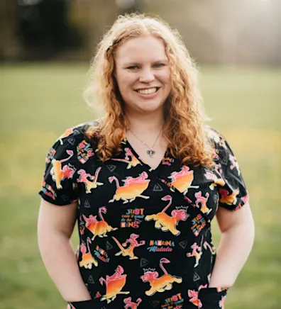 MacKenzie Curley standing outside with her hands in her pockets