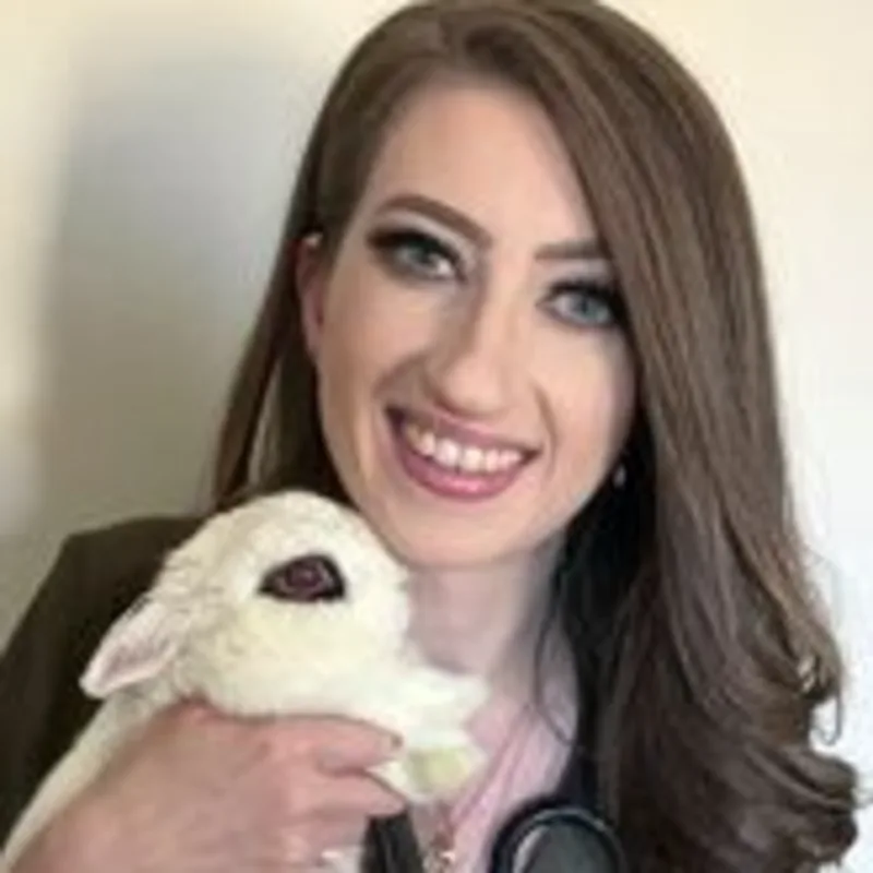 Meghan Armstrong holding a white bunny Meghan Armstrong holding a white bunny