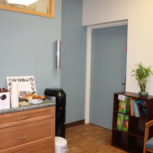 Waiting room with furniture and chairs inside of Northampton Veterinary Clinic 