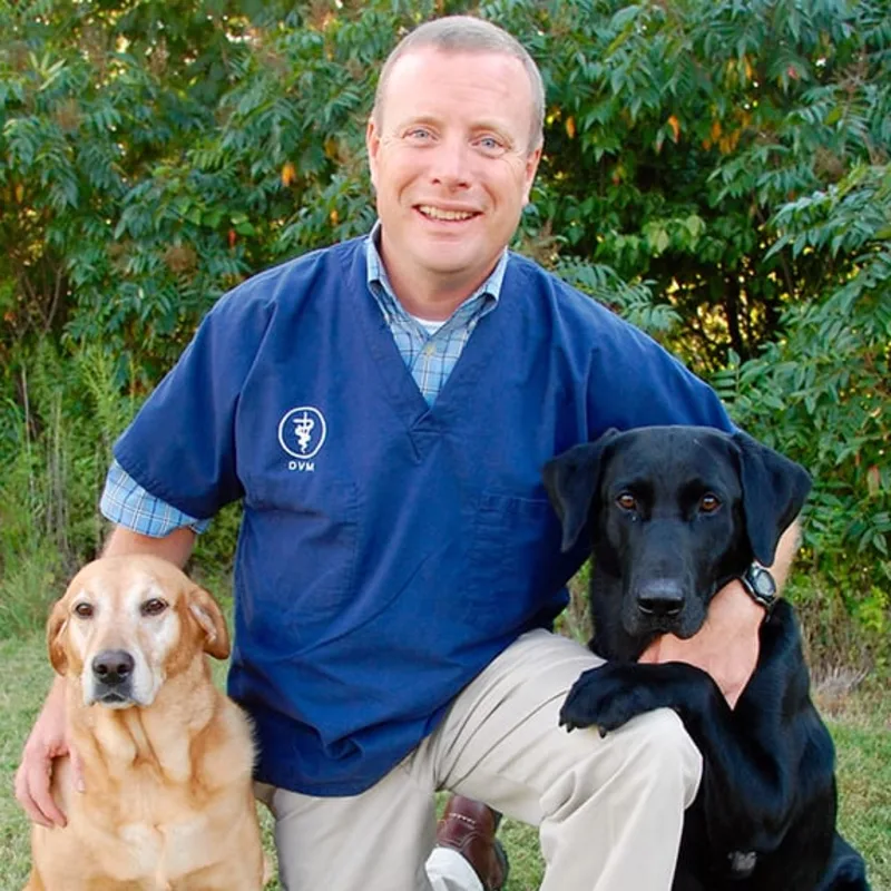 Dr. Jim Burchett with two dogs Dr. Jim Burchett with two dogs