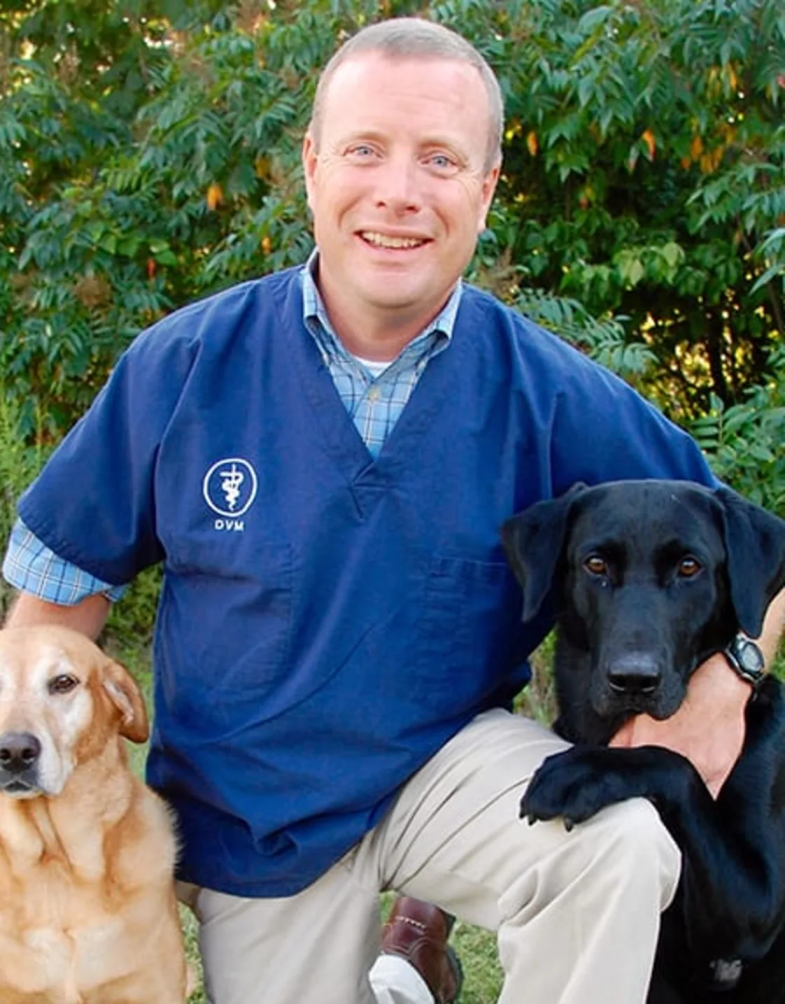 Dr. Jim Burchett with two dogs Dr. Jim Burchett with two dogs