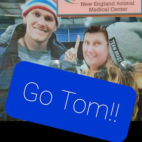 Staff member pretending to pose with Tom Brady Staff member pretending to pose with Tom Brady