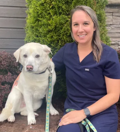 Justine sitting with her dog Justine sitting with her dog