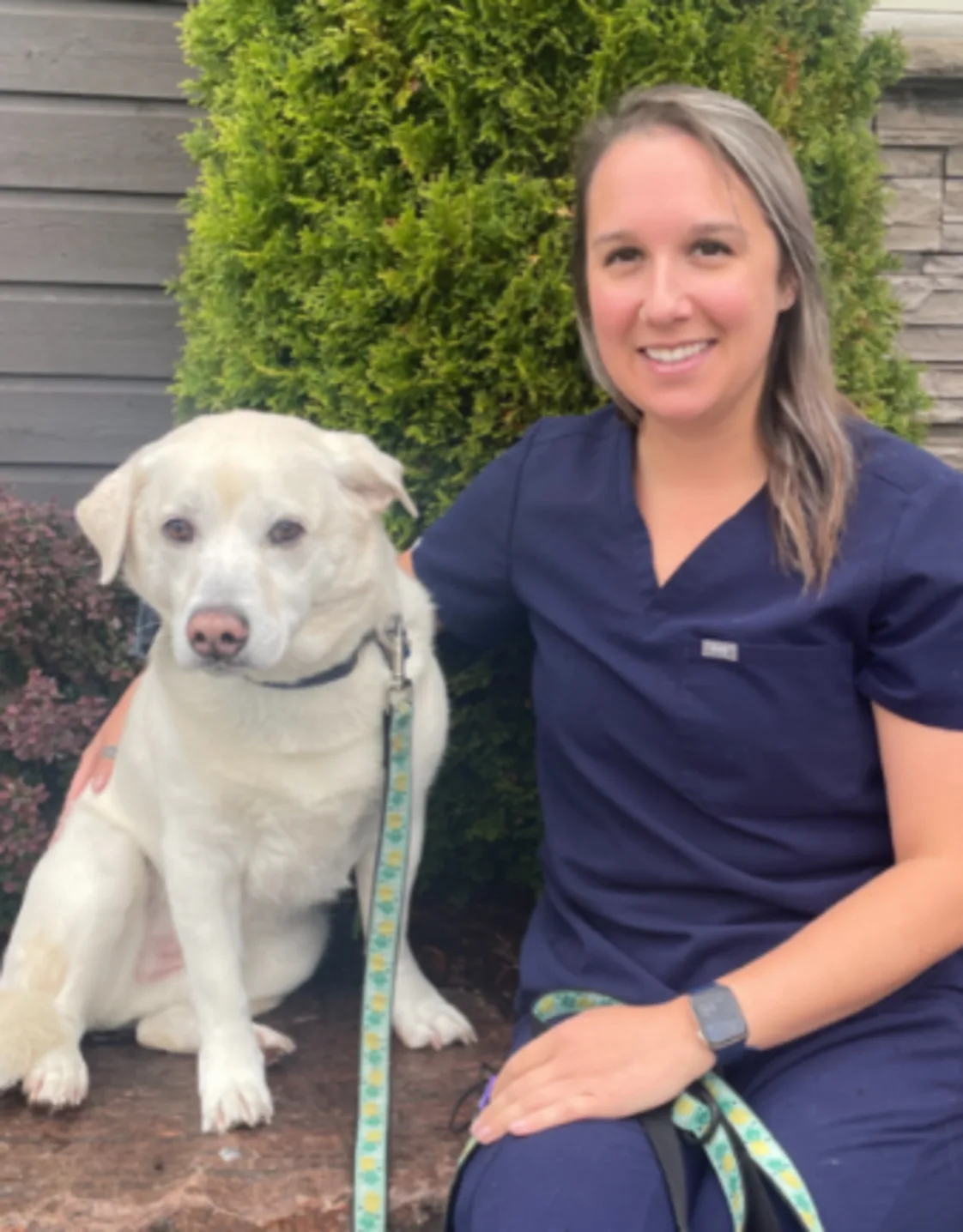 Justine sitting with her dog Justine sitting with her dog