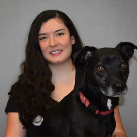 Melissa with a black dog