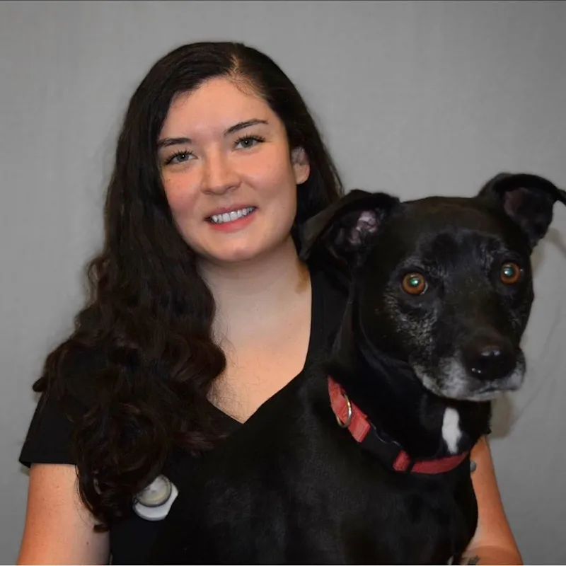 Melissa with a black dog Melissa with a black dog