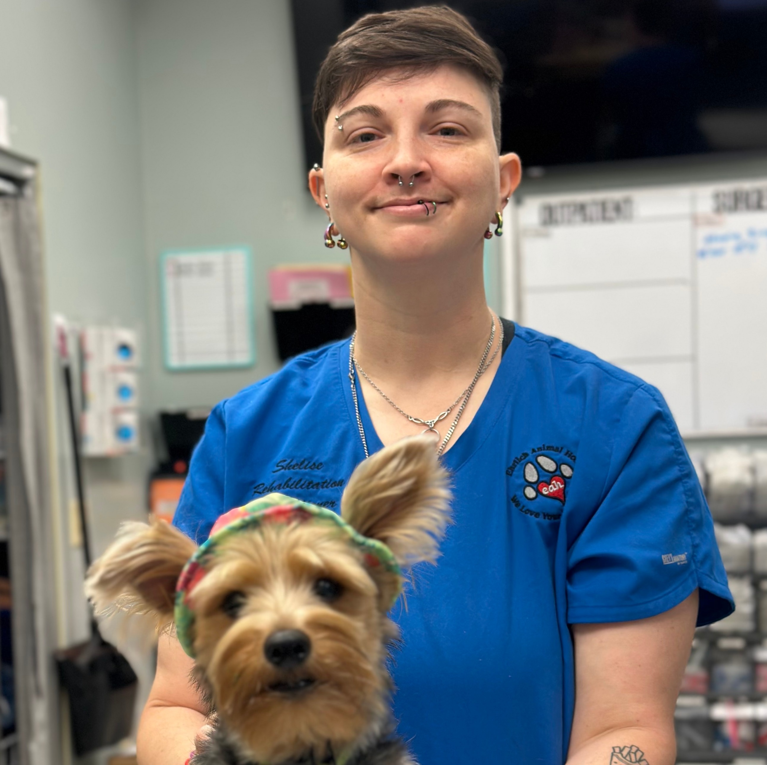 Shelise with an opossum on her shoulder